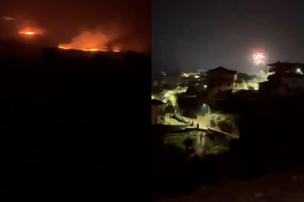 Un pueblo de fiesta con fuegos artificiales mientras al lado Jarilla está envuelta en llamas